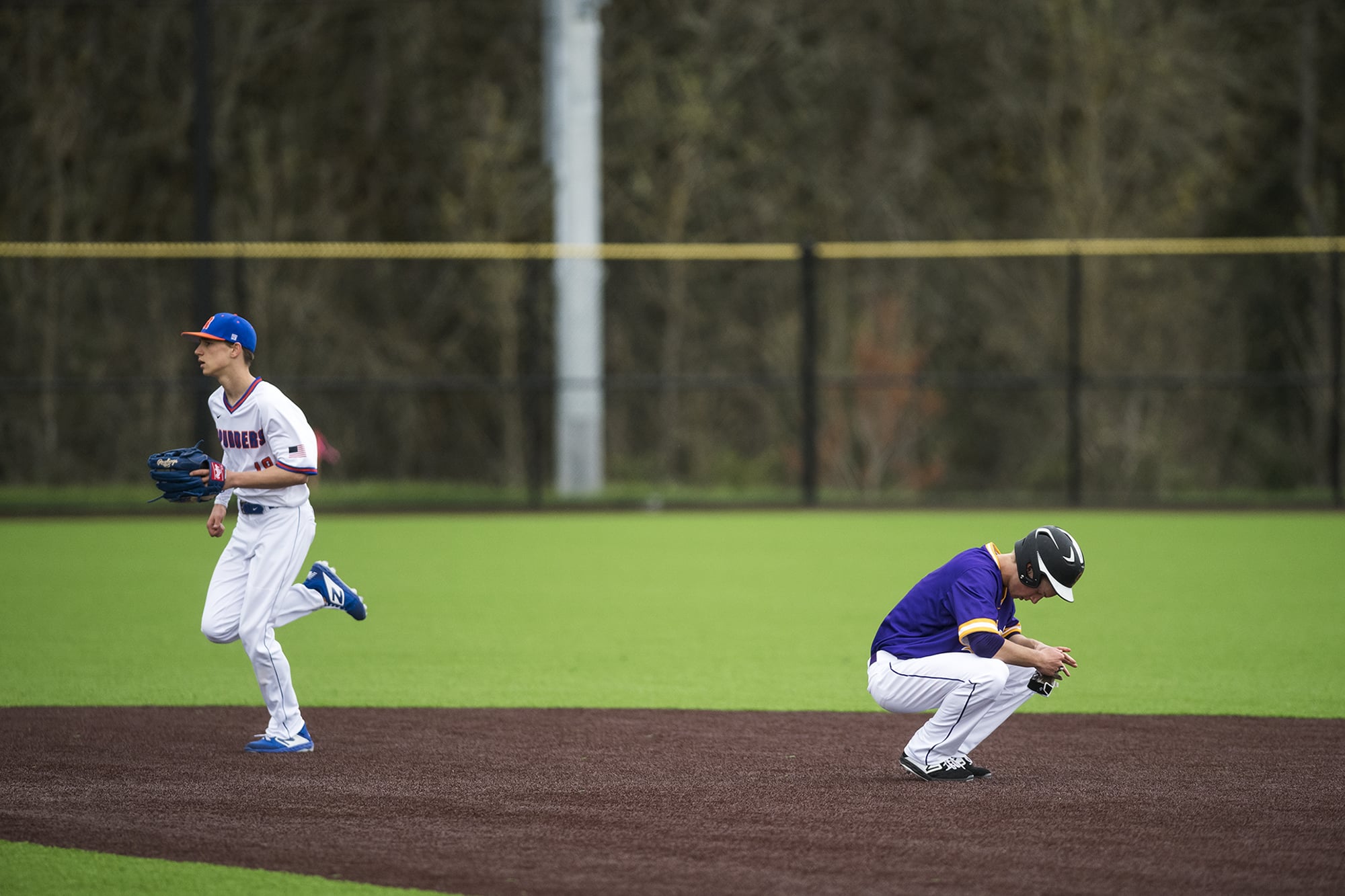 Columbia River's Cole Delich reacts to being called out at Second Base during a game against Ridgefield at the Ridgefield Outdoor Recreation Center on Tuesday night, April 16, 2019.