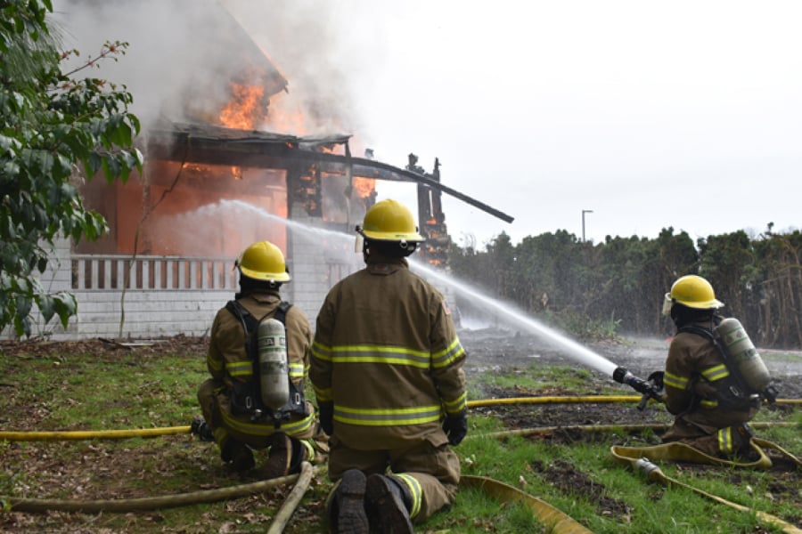 Clark County Fire District 3 firefighters fight a blaze in an empty structure during a training exercise April 15 in Brush Prairie. The district, which responded to 55 local wildfires last year, is preparing for a potentially active, early start to fire season.
