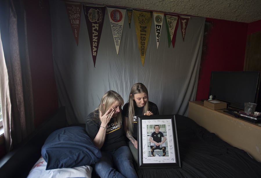 Sharyn Little wipes away a tear as she looks at a photo of her son Michael Little, who at 17 died of cancer last fall. Her daughter, Lauren, joined her in his bedroom Thursday morning. Michael was a senior at Hudson’s Bay High School when he died in October. He will participate posthumously in Mr. and Ms. Hudson’s Bay, a mock beauty pageant to raise money for Doernbecher Children’s Hospital.