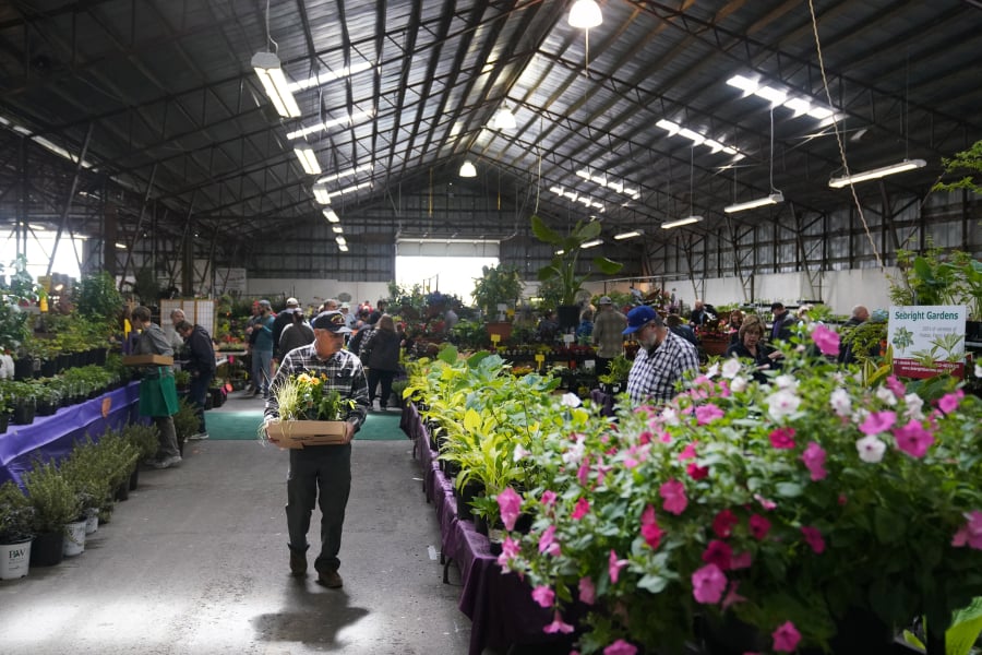 People explore the plant sale at the Home & Garden Idea Fair at the Clark County Event Center at the Fairgrounds. The annual event is presented by Clark Public Utilities.