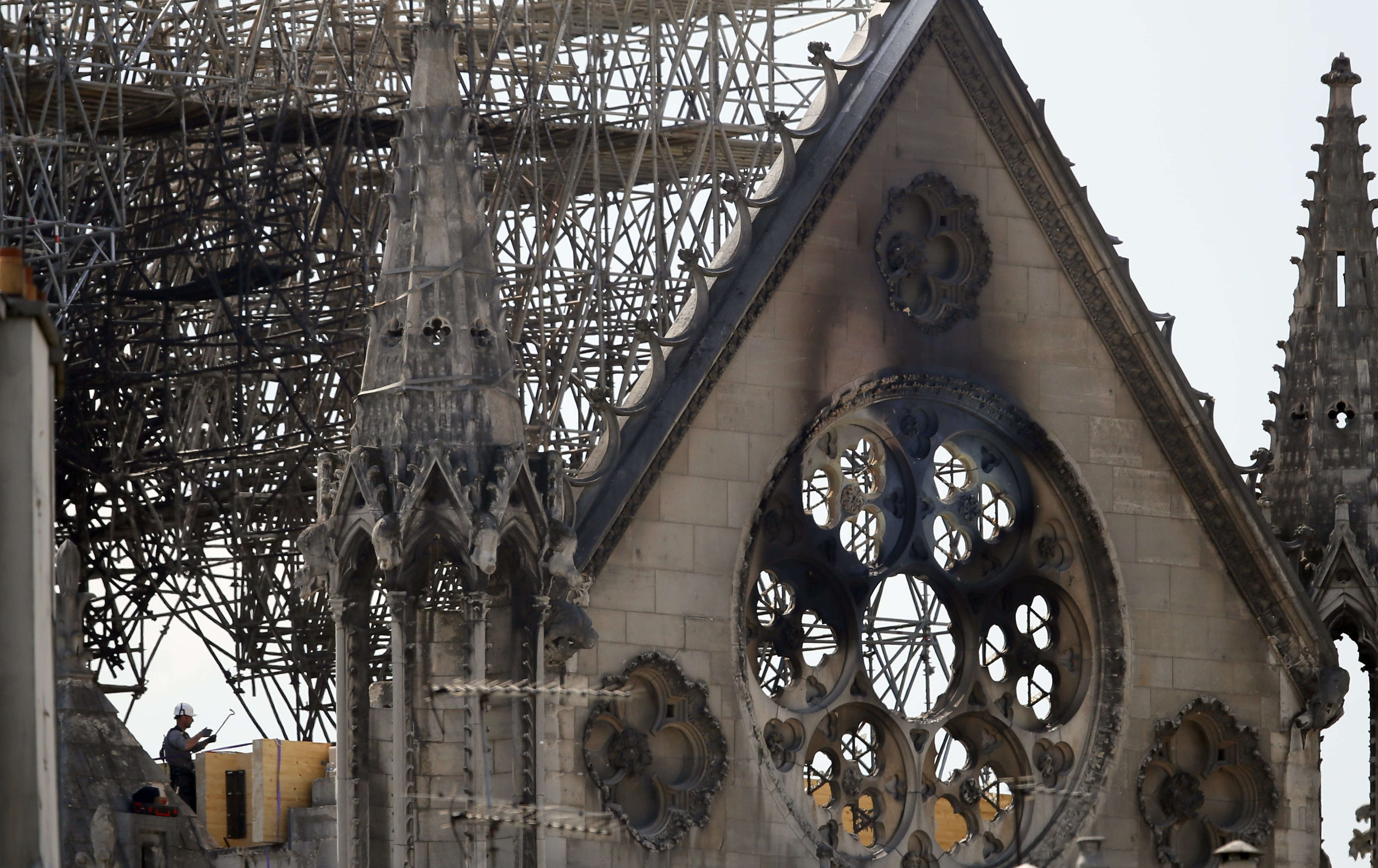 A worker checks on a wooden support structure placed on the Notre Dame Cathedral in Paris, Wednesday, April 17, 2019. Nearly $1 billion has already poured in from ordinary worshippers and high-powered magnates around the world to restore Notre Dame Cathedral in Paris after a massive fire.