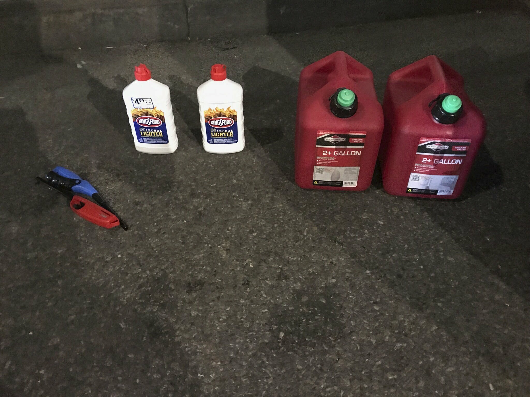 This photo posted on the New York Police Department's Twitter page shows gas cans and lighter fluid that a New Jersey man was seen carrying as he entered St. Patrick’s Cathedral, Wednesday, April 17, 2019, in New York. The suspect has been arrested.
