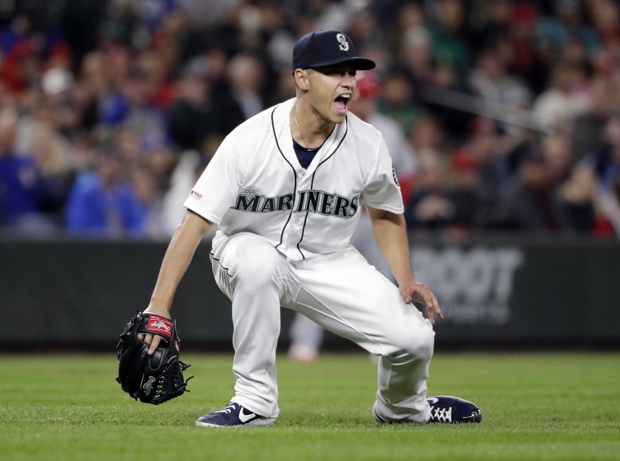Seattle Mariners starting pitcher Marco Gonzales lets out a yell after an out against the Los Angeles Angels in the eighth inning of a baseball game, Tuesday, April 2, 2019, in Seattle.