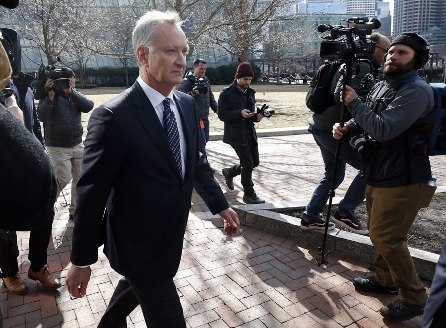 FILE - In this April 3, 2019 file photo, TobyMacFarlane departs federal court in Boston after facing charges in a nationwide college admissions bribery scandal. Authorities said Tuesday, April 23, that MacFarlane, a former senior executive at a title insurance company, will plead guilty to racketeering conspiracy and cooperate with federal authorities in the case.
