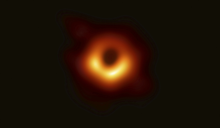 This image released Wednesday, April 10, 2019, by Event Horizon Telescope shows a black hole. Scientists revealed the first image ever made of a black hole after assembling data gathered by a network of radio telescopes around the world.