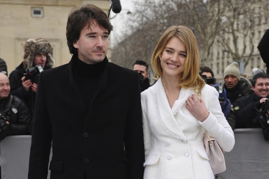 FILE - In this Friday, March 1, 2013 file photo Antoine Arnault and Natalia Vodianova arrive for Dior’s Ready to Wear’s Fall-Winter 2013-2014 fashion collection presented in Paris. As the France woke up in collective sadness at the fire damage to Notre Dame cathedral, its richest businessman, Bernard Arnault, the father of Antoine, and his luxury goods group LVMH answered that call with a pledge of 200 million euros ($226 million).