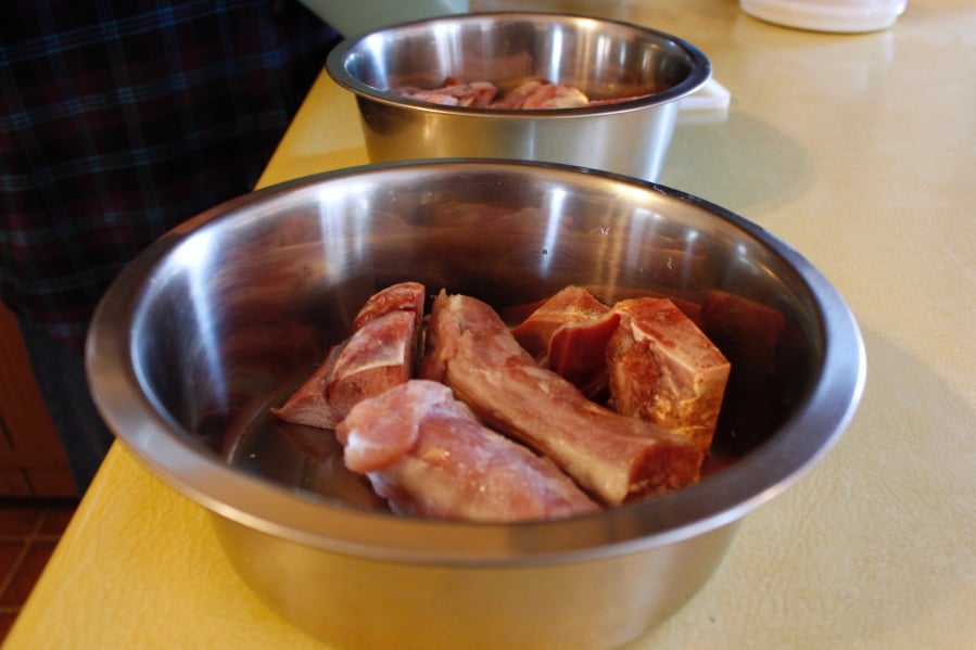 Turkey necks and gizzards that are being served to Gracie and Takaani, two German shepherds who live in Oconomowoc, Wis.
