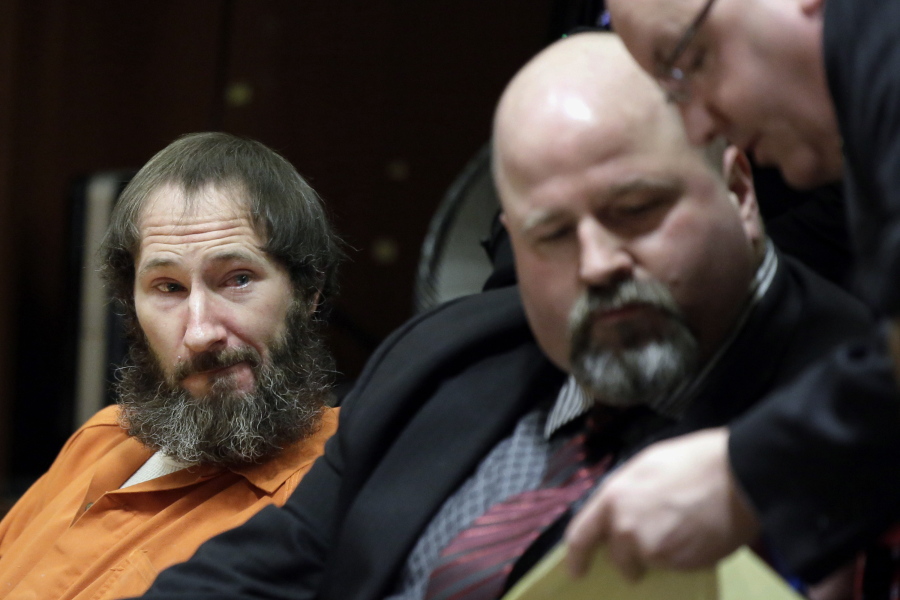 FILE- In this March 8, 2019 file photo, Johnny Bobbitt, left, looks on as his attorney John Keesler and Assistant Prosecutor Andrew McDonnell, right, talk while appearing before Superior Court Judge Christopher Garrenger at the Burlington County Courthouse in Mount Holly, N.J. Bobbitt, who pleaded guilty to taking part in a $400,000 GoFundMe scam with a New Jersey couple, will face sentencing on Friday, April 12.