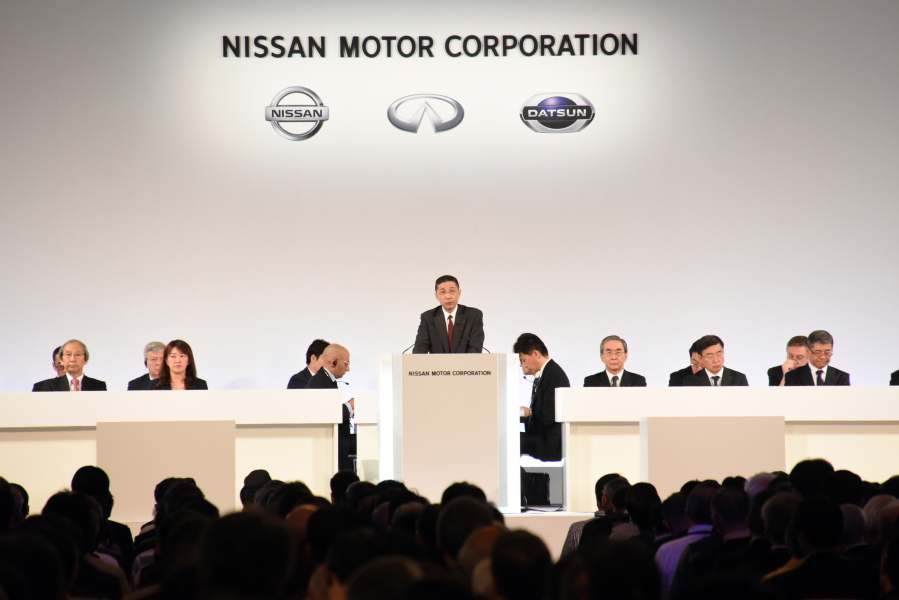 In this photo released by Nissan Motor Co., Nissan Chief Executive Hiroto Saikawa, center, speaks at the company’s shareholders’ meeting in Tokyo Monday, April 8, 2019. Nissan shareholders approved on Monday the ouster from the Japanese automaker’s board former Chairman Carlos Ghosn, who faces allegations of financial misconduct. (Nissan Motor Co.