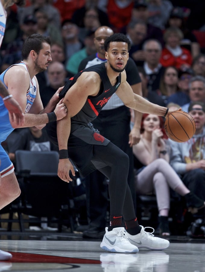 Portland Trail Blazers forward Skal Labissiere, right, posts up against Sacramento Kings forward Nemanja Bjelica during the first half of an NBA basketball game in Portland, Ore., Wednesday, April 10, 2019.