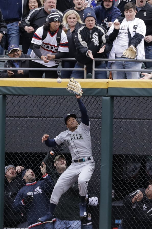 Seattle Mariners center fielder Mallex Smith can’t make the play on a two-run double by Chicago White Sox’s Yoan Moncada during the first inning of a baseball game Friday, April 5, 2019, in Chicago. (AP Photo/Nam Y.