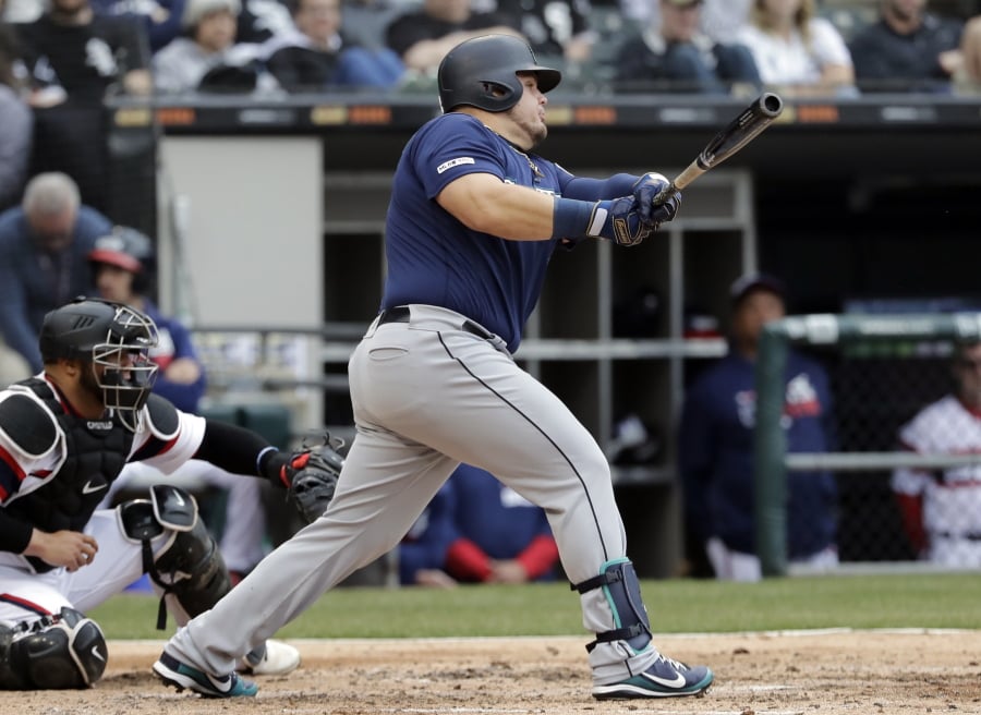 Seattle Mariners’ Daniel Vogelbach hits a three-run double against the Chicago White Sox during the third inning of a baseball game in Chicago, Sunday, April 7, 2019. (AP Photo/Nam Y.