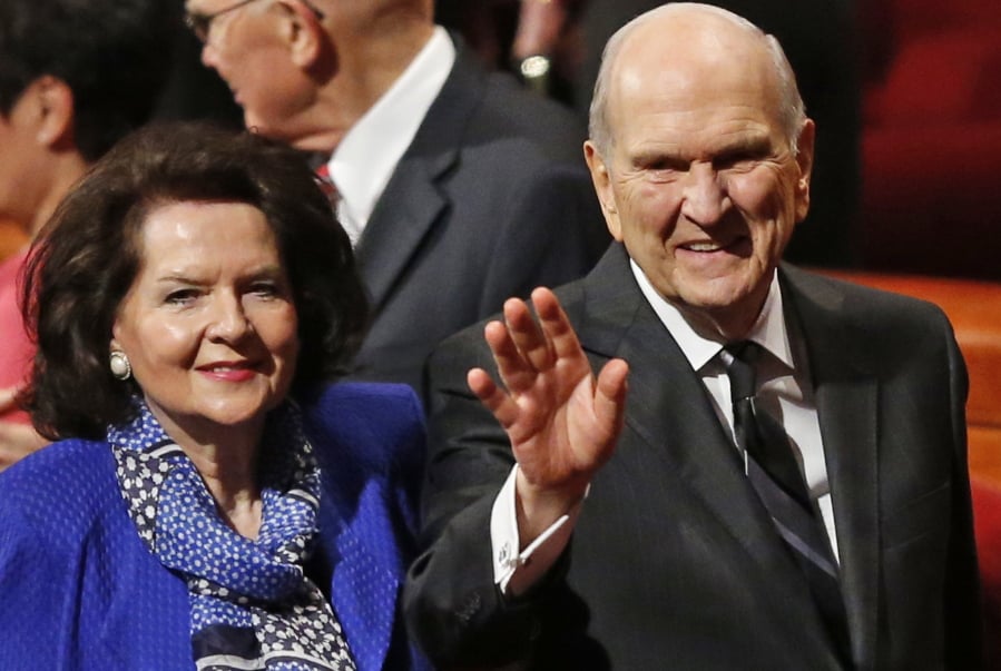 FILE - In this Oct. 6, 2018, file photo, President Russell M. Nelson and his wife, Wendy, wave as they leave the morning session of a twice-annual conference of The Church of Jesus Christ of Latter-day Saints in Salt Lake City. Nelson has generated buzz in his first year by becoming one of the most visible presidents in modern church history and implementing a number of changes.