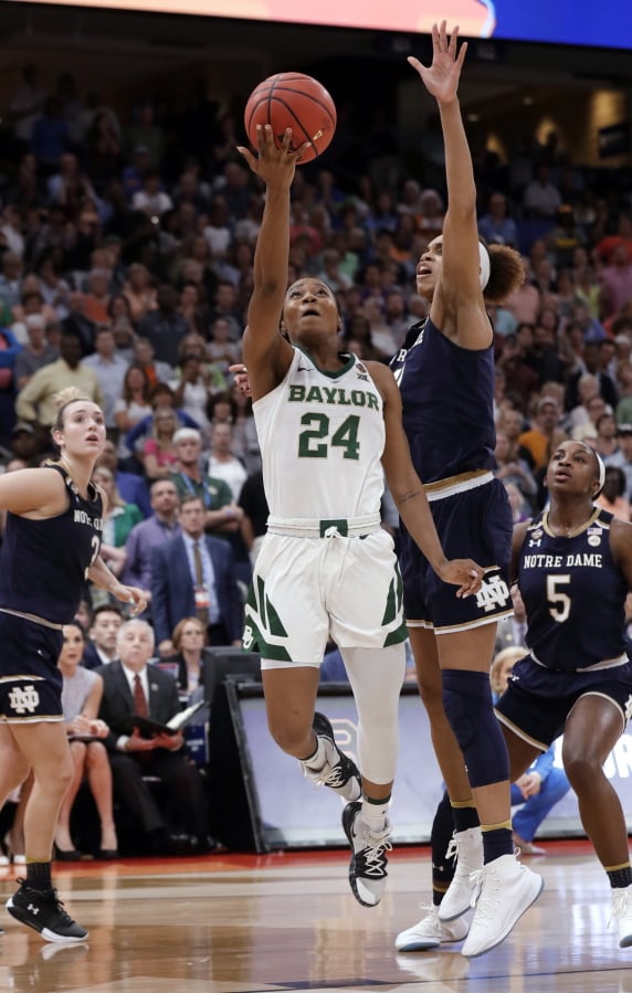 Baylor guard Chloe Jackson (24) scores the go-ahead basket as Notre Dame forward Brianna Turner (11) defends in the closing seconds of the Final Four championship game of the NCAA women's college basketball tournament Sunday, April 7, 2019, in Tampa, Fla. Watching are Notre Dame guard Jackie Young (5) and guard Marina Mabrey (3). Baylor won 82-81.