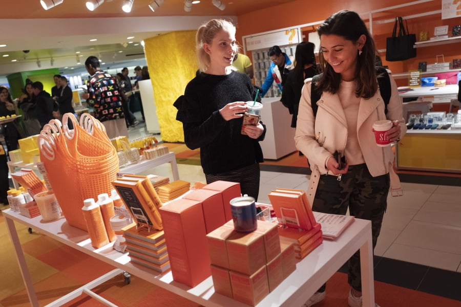 FILE - In this April 10, 2019, file photo visitors to Story walk through the shop now located at Macy’s in New York. On Thursday, April 18, the Commerce Department releases U.S. retail sales data for March.