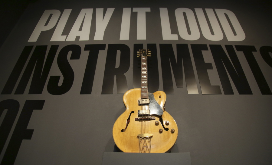 A guitar played by Chuck Berry is displayed at the entrance to the exhibit “Play It Loud: Instruments of Rock & Roll” at the Metropolitan Museum of Art in New York, Monday, April 1, 2019. The exhibit, which showcases the instruments of rock and roll legends, opens to the public on April 8 and runs until Oct. 1, 2019.