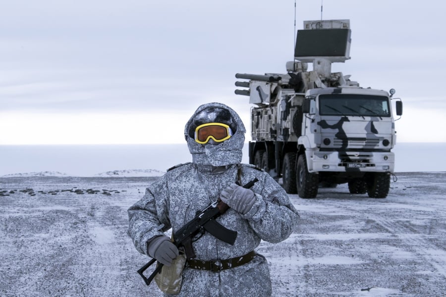 In this photo taken on Wednesday, April 3, 2019, a Russian solder stands guard as Pansyr-S1 air defense system on the Kotelny Island, part of the New Siberian Islands archipelago located between the Laptev Sea and the East Siberian Sea, Russia. Russia has made reaffirming its military presence in the Arctic the top priority amid an intensifying international rivalry over the region that is believed to hold up to one-quarter of the planet’s undiscovered oil and gas.