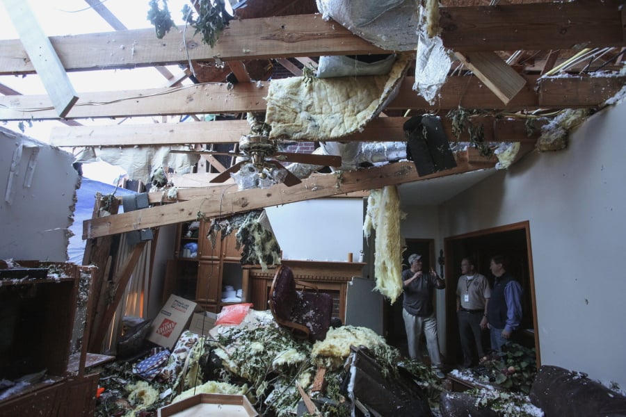 Pat McGuffie speaks with Warren County Sheriff Martin Pace and Lt. Gov. Tate Reeves about the damage at his home in Warren County, Miss., Tuesday, April 16, 2019, following Saturday evening’s tornados that swept through Vicksburg and Warren County.
