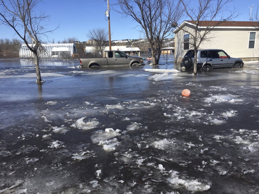 This March 2019 photo provided by Henry Red Cloud, shows flooding on Cloud’s Lakota Solar Enterprises property on the Pine Ridge Reservation in southern South Dakota. Red Cloud estimates flood damage at $250,000. Plains and Midwest states are bracing for another massive winter storm Wednesday and Thursday and the prospect of renewed flooding when the snow melts.