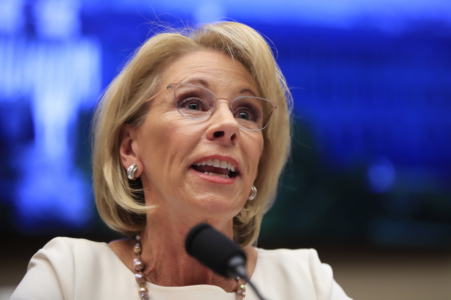 In this Wednesday, April 10, 2019, file photo, Education Secretary Betsy DeVos testifies before the House Education and Labor Committee on Capitol Hill in Washington. A political battle is reheating over a federal program that was designed to cancel student loans for certain public workers but has largely failed to deliver that promise. The program, Public Service Loan Forgiveness, promises to erase federal student loans for public workers who make 10 years of payments while working for approved employers.