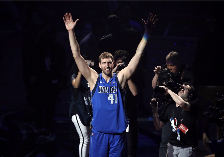 Dallas Mavericks’ Dirk Nowitzki acknowledges cheers from fans as he walks off the court following the team’s NBA basketball game against the Phoenix Suns in Dallas, Tuesday, April 9, 2019. The team honored Nowitkzi, who played his final home game of his 21-year career.
