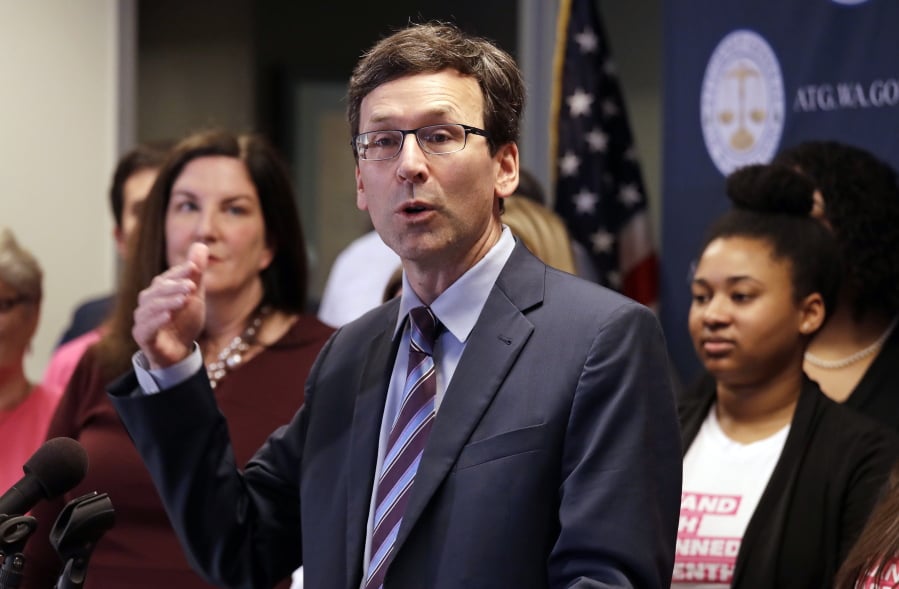 FILE - In this Feb. 25, 2019 file photo, Washington state Attorney General Bob Ferguson speaks at a news conference announcing a lawsuit challenging the Trump administration’s Title X “gag rule” in Seattle. A federal judge in Washington state on Thursday, April 25, 2019, will hear arguments in two cases against new Trump administration rules that could cut off federal funding for health care providers who refer patients for an abortion.
