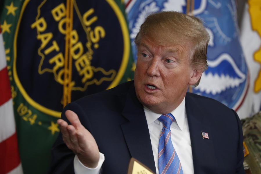 In this April 5, 2019 photo, President Donald Trump participates in a roundtable on immigration and border security at the U.S. Border Patrol Calexico Station in Calexico, Calif. Trump said Friday he is considering sending “Illegal Immigrants” to Democratic strongholds to punish them for inaction— just hours after White House and Homeland Security officials insisted the idea was dead on arrival.