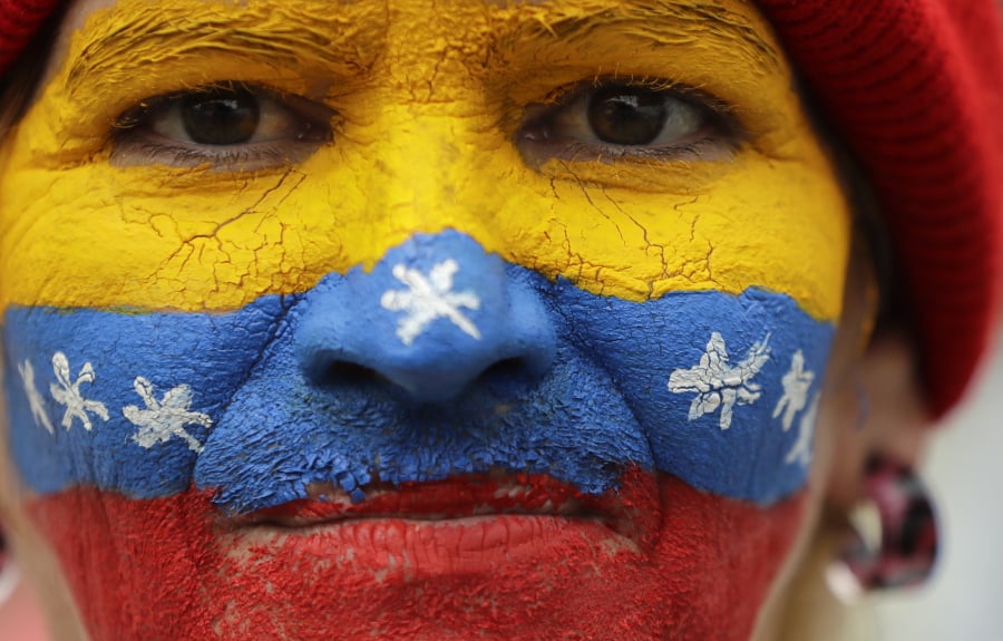 Her face painted in the colors of the national flag, a supporter of opposition leader Juan Guaido, Venezuela’s self-proclaimed interim president, waits for his arrival in Los Teques, Miranda State, Venezuela, Saturday, March 30, 2019. Guaido addressed the crowd while Maduro loyalists gathered for what was billed as an “anti-imperialist” rally in the capital. Such dueling demonstrations have become a pattern in past weeks as Venezuela’s opposing factions vie for power in a country enduring economic turmoil and a humanitarian crisis.