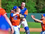 The members of the Ridgefield baseball team celebrate their 1-0 win over W.F. West on Wednesday, clinching a berth to the state tournament.