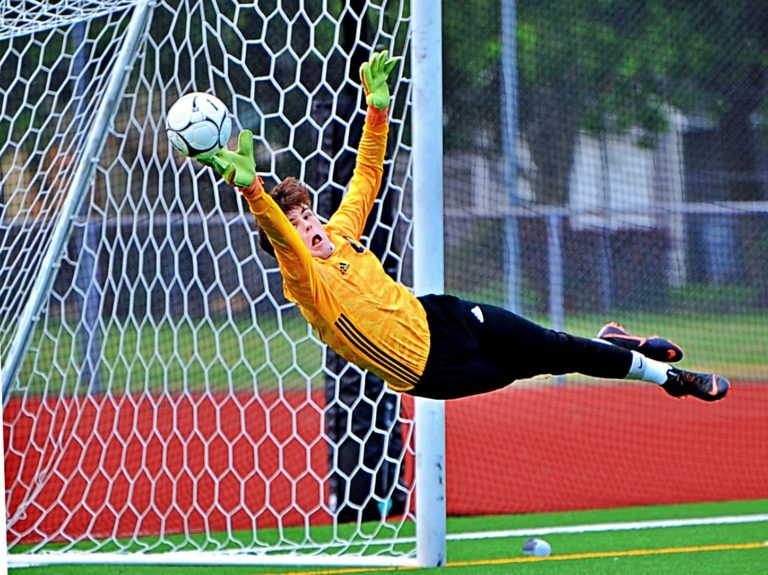 Mountain View goalkeeper Cole Taylor makes a fingertip save, one of six he made in the Thunder's 3-0 loss to Lakeside in the 3A State semifinals on Friday at Carl Sparks Stadium in Puyallup.