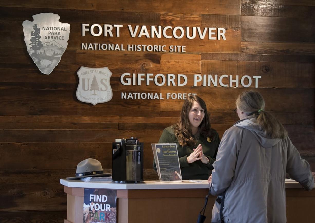 Jacquelyn Scholtz, park guide at Fort Vancouver National Historic Site, assists Bonnie Matz of Portland as she stops by the Visitors Center in January.