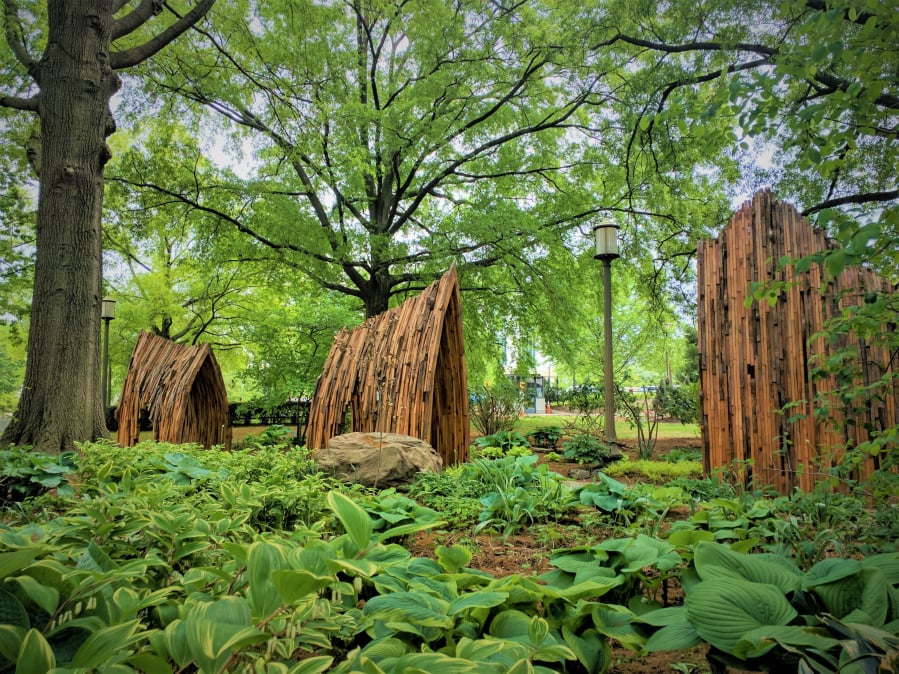 Smithsonian Gardens has opened its first museumwide exhibition, “Habitat,” to convey the importance of gardening for wildlife. Outside the National Museum of American History is the sculpture “Arches of Life,” by Foon Sham.
