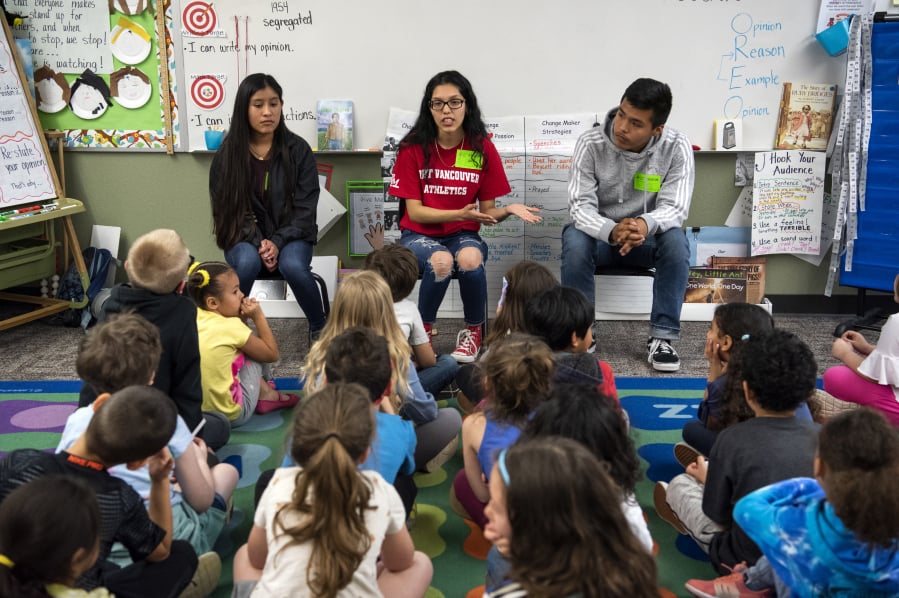 Students from Fort Vancouver High School Center for International Studies, including, from left, junior Alma Melchor, senior Lindsey Luis, center, and sophomore Gerardo Melchor, visited Crestline Elementary School last week to answer questions about how kids can make change in their local communities.