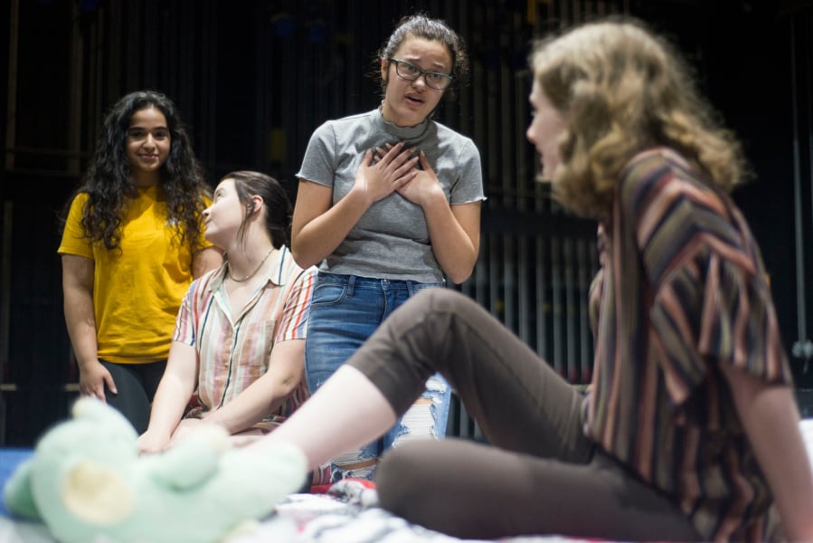 Camas High School theater students Sara Akhtarkhavari, from left, Laura Johnson and Cameron Kolkemo console Rae, the main character played by fellow student Chloe Higgins, during a rehearsal.