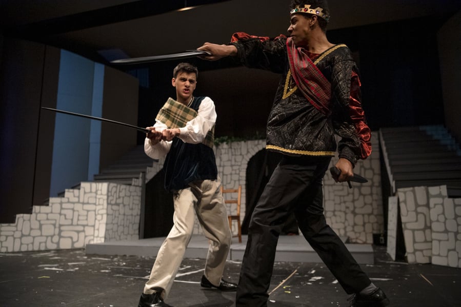 MacDuff (Justin Linsday), left, can no longer endure the savagery of Macbeth (Jaleel Amusa) during his climb to the throne.