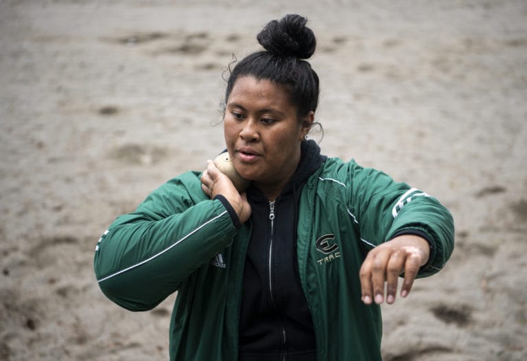 Evergreen junior Jasmine Tiatia sets up to throw during practice with her coach and teammates at McKenzie Stadium in Vancouver on Wednesday, May 15, 2019.
