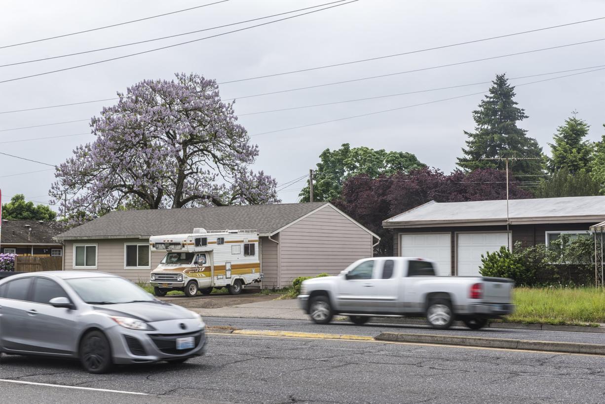Cars drive past 10605 SE Mill Plain Blvd, which the city has voted to condemned to accommodate a safety corridor, on Wednesday morning, May 15, 2019.