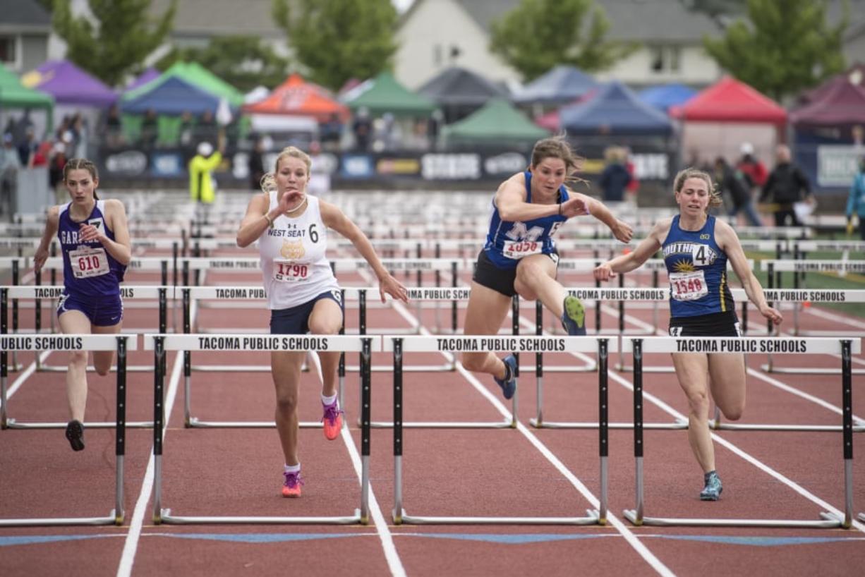 Mountain View’s Kate Kadrmas, center right, leads the pack to win the 3A Girls 100m Hurdles during the WIAA state track meet at Mount Tahoma High School in Tacoma on Friday, May 24, 2019.