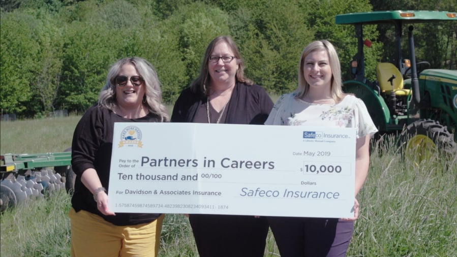 partners in careers West Vancouver: The nonprofit group Partners in Careers was awarded a $10,000 from local agency Davidson & Associates Insurance through the 2019 Safeco Insurance Make More Happen Award program. From left, Carmen Jacobson, Safeco Insurance; Sharon Pesut, Partners in Careers; and Emily McCoy, Davidson & Associates Insurance, hold the check, which will benefit veterans in need.