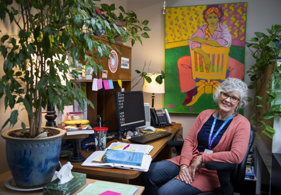 Margo Priebe, a legal advocacy specialist at YWCA Clark County in Vancouver, fills her office with plants, paintings and things that bring her joy. “It’s really, really hard work, so you need to have a beautiful environment,” she said. Priebe was a victim of domestic violence when she was a child and was drawn to the job to try to heal herself as well as others.