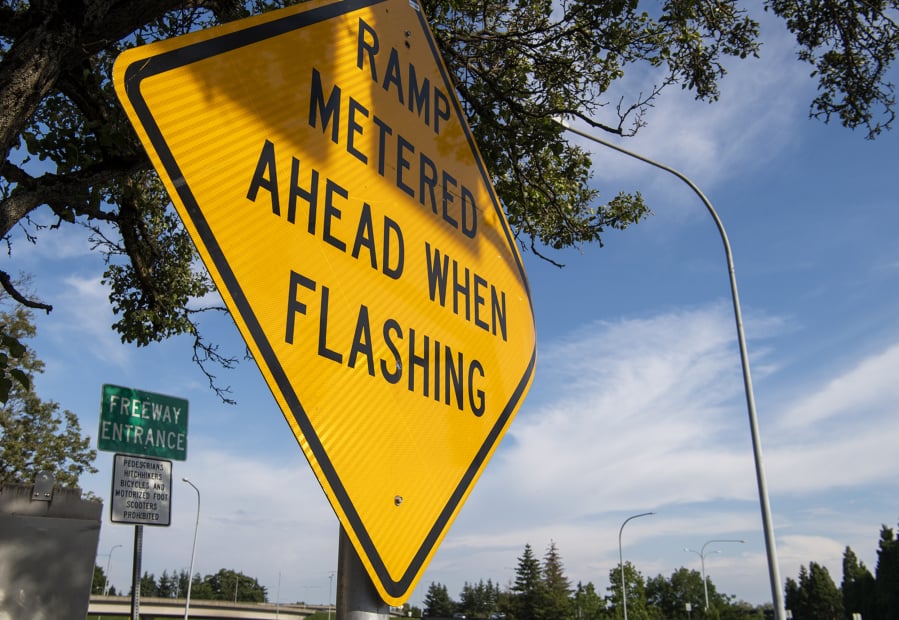 Metered ramp warnings are posted just off of Washington Street at the beginning of the I-5 onramp before the Interstate 5 Bridge in Vancouver on Thursday, May 30, 2019.
