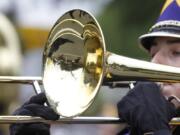 Underlying the shiny, brassy sound of the many marching bands in the Hazel Dell Parade is the organizational labor and data mangament of of Jody and Matt Gohlke at Music World.