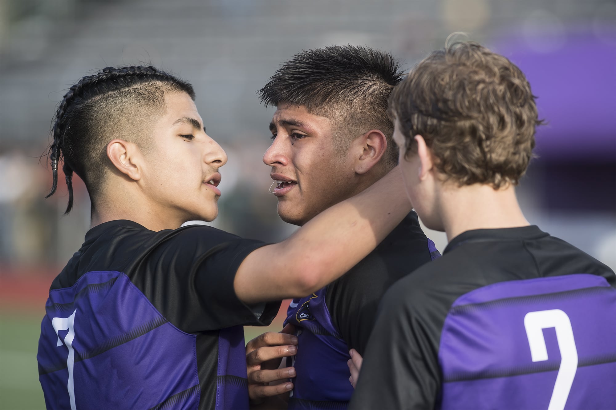 Columbia River players comfort eachother following their loss to Sehome during the WIAA 2A Championship title game at Sumner High School on Saturday afternoon, May 25, 2019 (Nathan Howard/The Columbian)