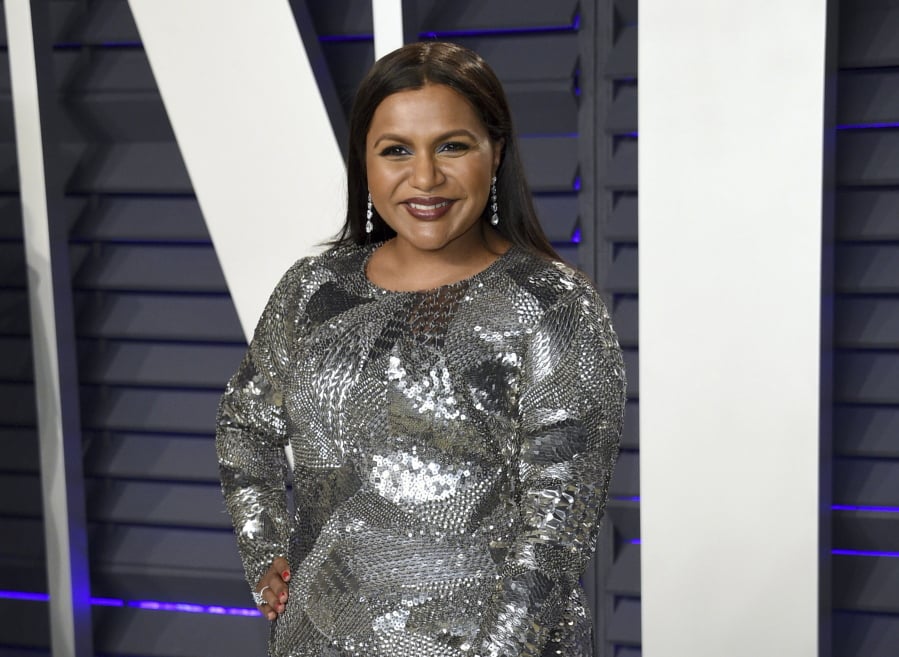 FILE - This Feb. 24, 2019 file photo shows Mindy Kaling at the Vanity Fair Oscar Party in Beverly Hills, Calif. Kaling plans to release a third collection of essays in the summer 2020. Amazon announced Tuesday, May 28, that topics will include Kaling’s experience as a single mother and working with Reese Witherspoon and Oprah Winfrey.