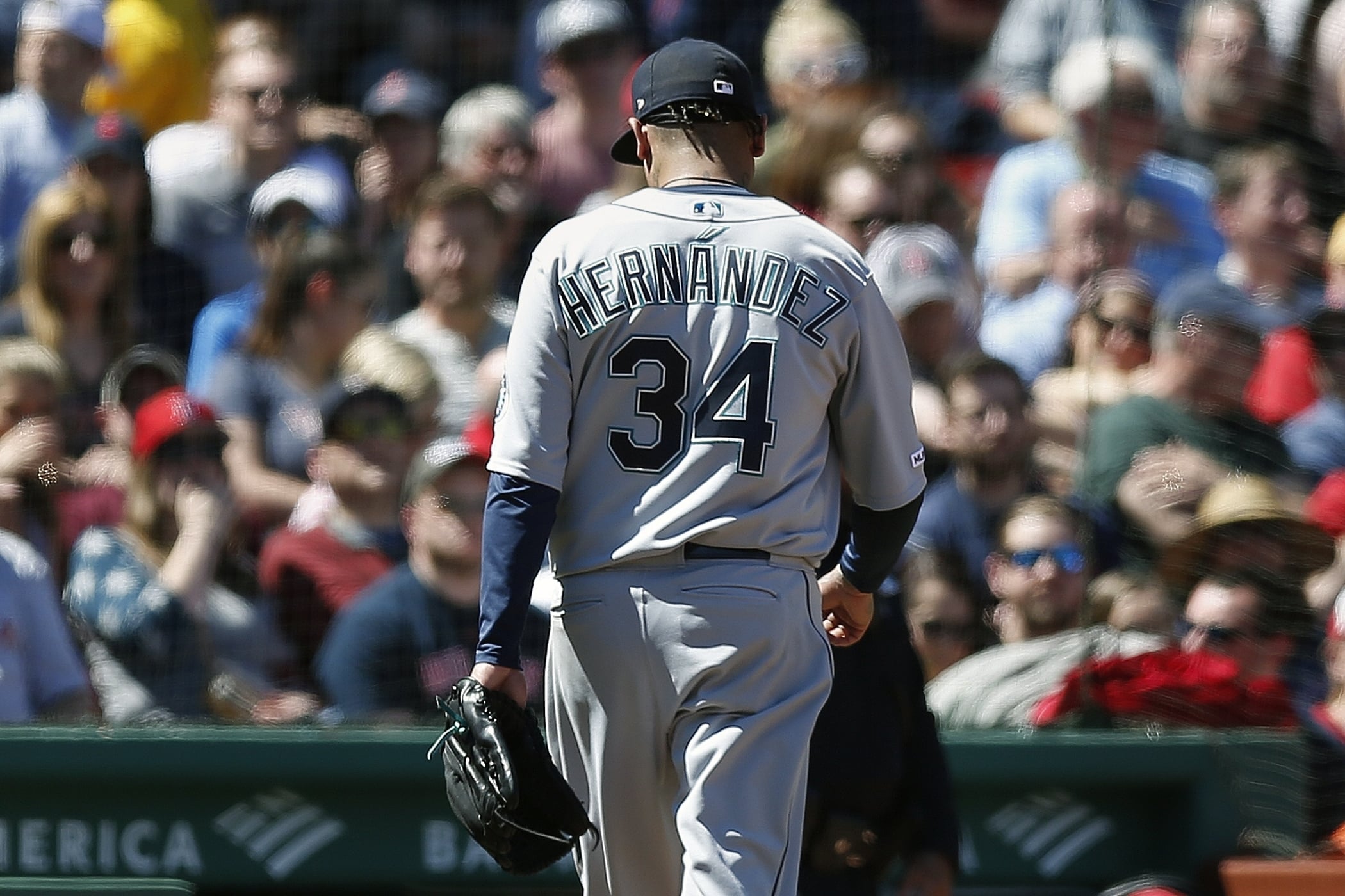 Seattle Mariners' Felix Hernandez walks off the field after being relieved during the third inning of a baseball game against the Boston Red Sox in Boston, Saturday, May 11, 2019.