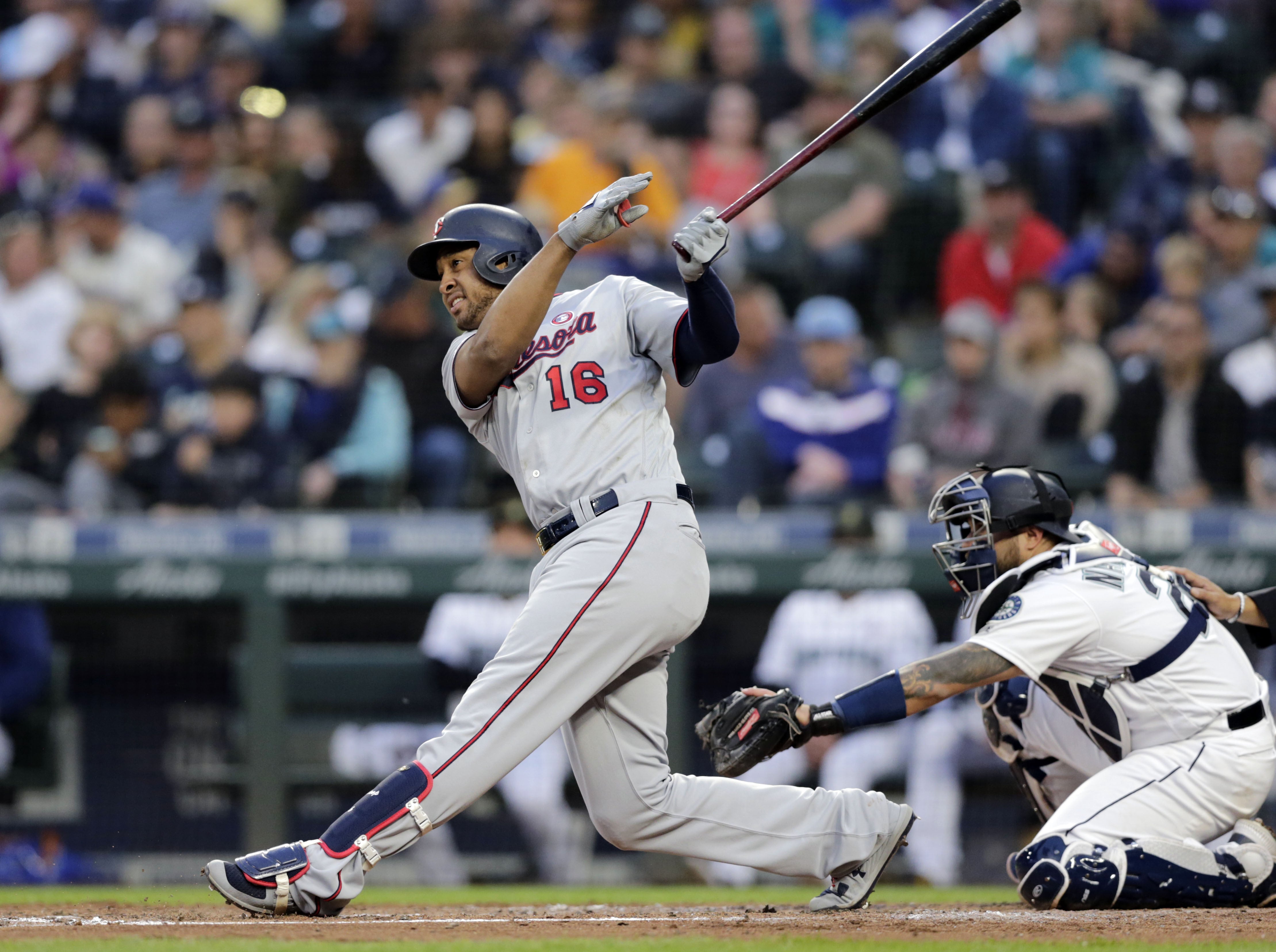 Minnesota Twins' Jonathan Schoop follows through on a three-run home run off Seattle Mariners' Parker Markel during the third inning of a baseball game, Saturday, May 18, 2019, in Seattle.