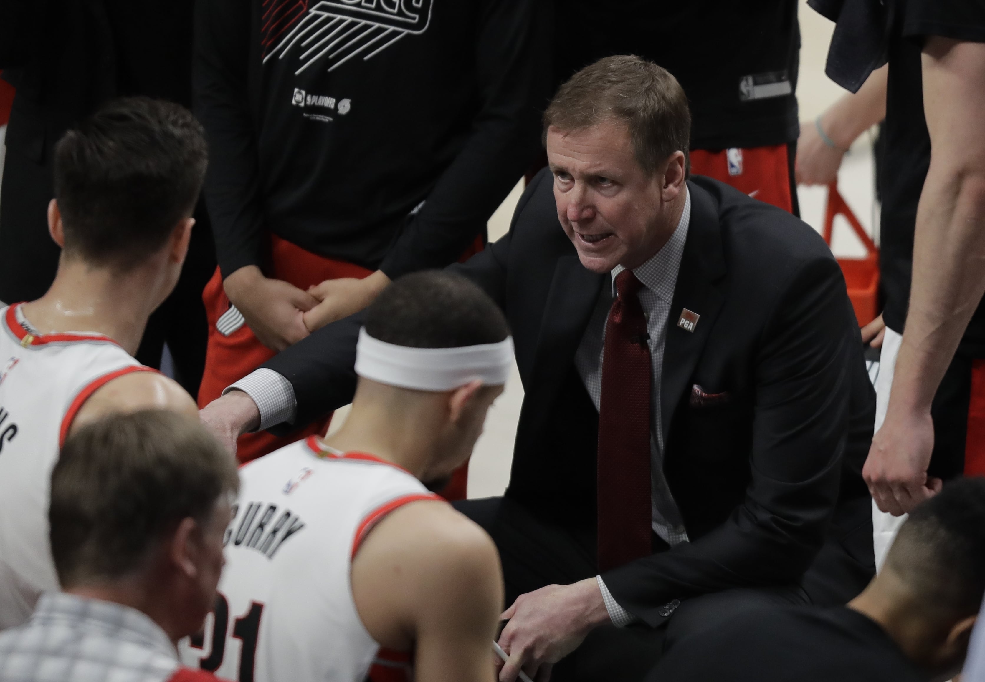 Portland Trail Blazers head coach Terry Stotts talks to his team during a time out in the second half of Game 3 of the NBA basketball playoffs Western Conference finals against the Golden State Warriors, Saturday, May 18, 2019, in Portland, Ore. The Warriors won 110-99. (AP Photo/Ted S.