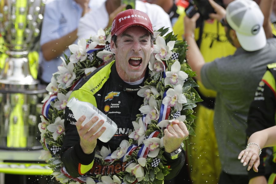 Simon Pagenaud, of France, celebrates after winning the Indianapolis 500 IndyCar auto race at Indianapolis Motor Speedway, Sunday, May 26, 2019, in Indianapolis.