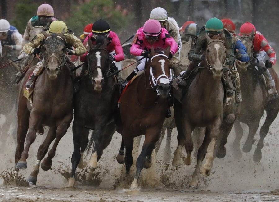 Flavien Prat on Country House, left, races against Luis Saez on Maximum Security, third from left, during the 145th running of the Kentucky Derby horse race at Churchill Downs Saturday, May 4, 2019, in Louisville, Ky. Maximum Security was disqualified and Country House won the race.
