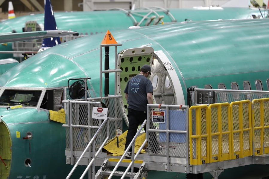 FILE - This March 27, 2019, file photo shows a Boeing 737 MAX 8 airplane on the assembly line during a brief media tour of Boeing’s 737 assembly facility in Renton, Wash. Recent crashes have caused an uptick in airline fatalities in 2018 and 2019 after a long trend of safer flying. Boeing 737 Max accidents have raised concern over the ability of all pilots to handle automation. Still, aviation deaths are down sharply from the 1990s, and experts credit advances in aircraft and airport design, better air traffic control, and more pilot training. (AP Photo/Ted S.